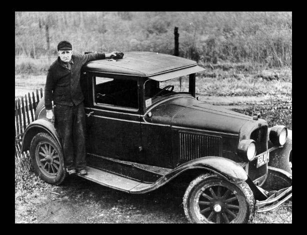 Benld Meteorite. Ed McCain near the car that was hit by the meteorite. 1938.Credit Information: © The Field MuseumNeg. # GEO79617Photographer unknown