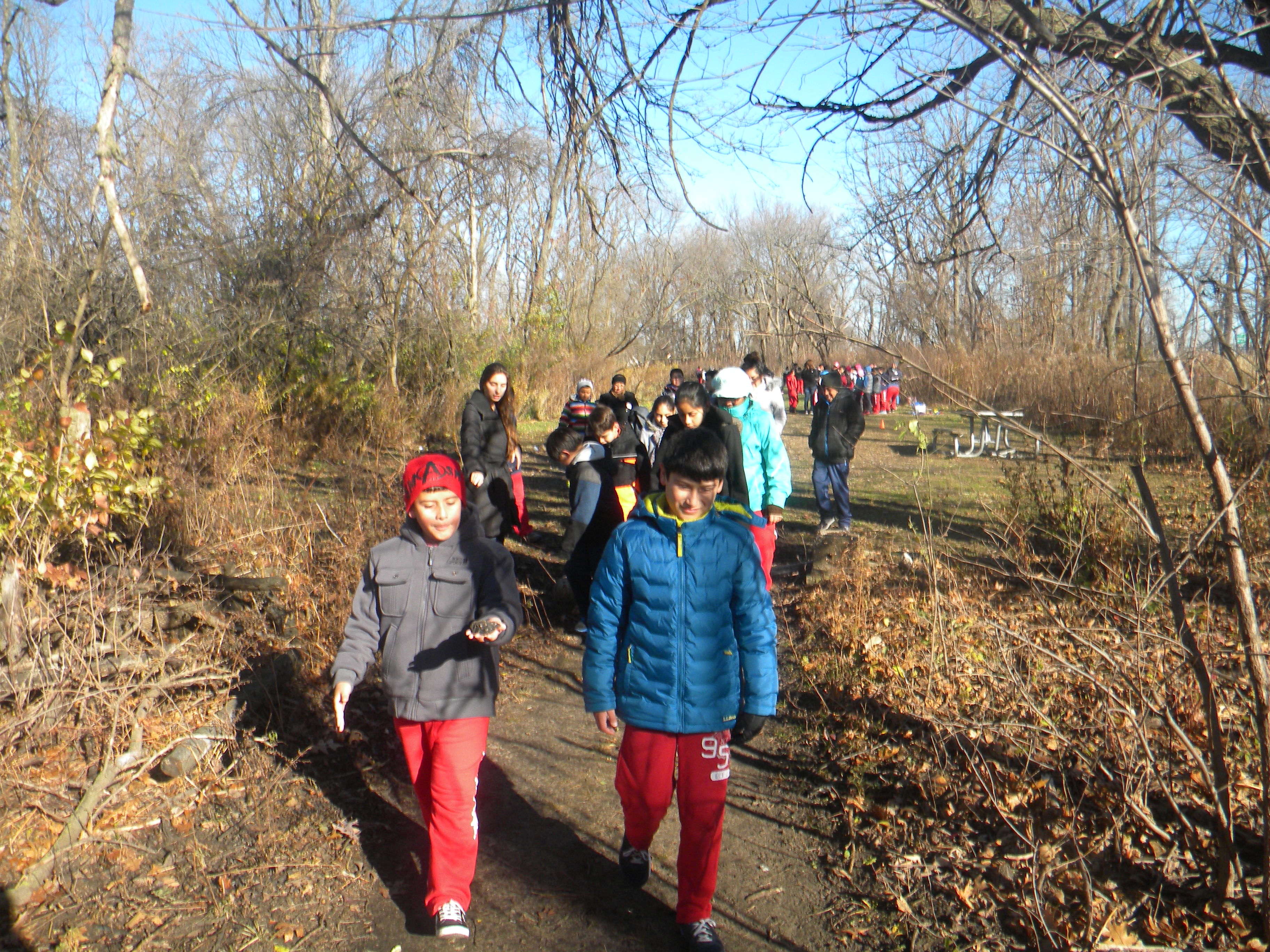 Fifth grade students begin their nature exploration hike during their Mighty Acorns field trip to Eggers Grove.