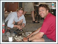 Grete Dinesen and Matthew Campbell chiseling rocks for boring bivalves.