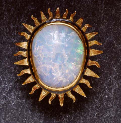 Opal Cabochon brooch with carved face of Sun God, gold mounting.Credit Information:© 2000 The Field Museum Neg. # GEO86314cPhotographer: John Weinstein
