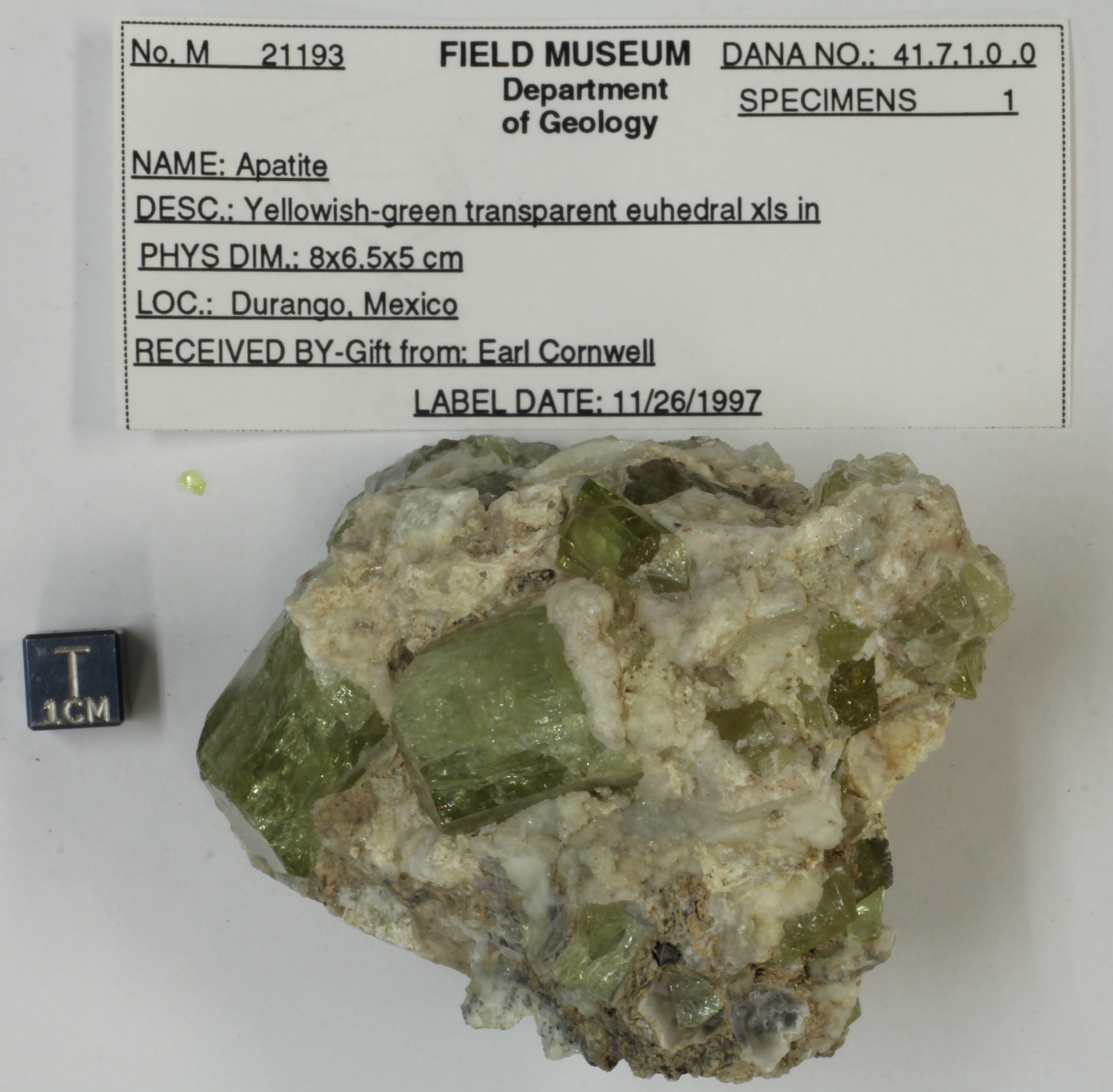 A stone with chunks of green mineral