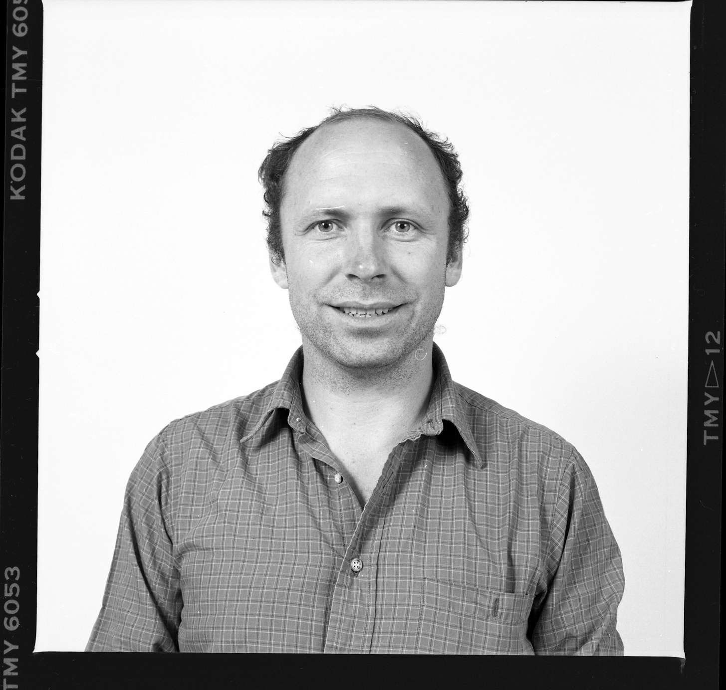 Bill’s passport photo from 1990, not long after he started at the Museum. Field Museum photo by John Weinstein. GN85573_12.