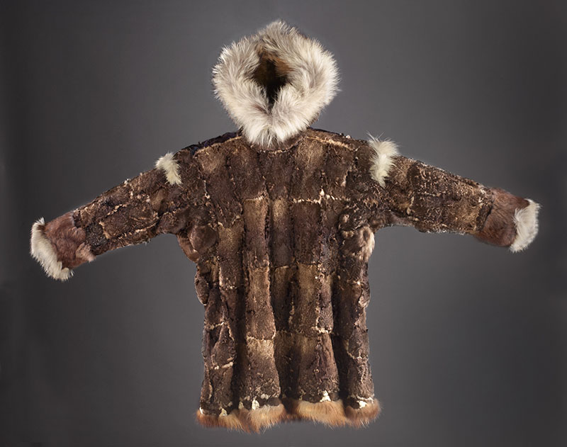 A brown and white coat made from animal skin and fur