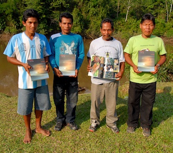 We published the Maijuna rapid inventory report in July 2010. The presentation of the results was emotional and the Maijuna were in buoyant spirits.
Leaders from each of the four Maijuna communities with their inventory books. A. del Campo