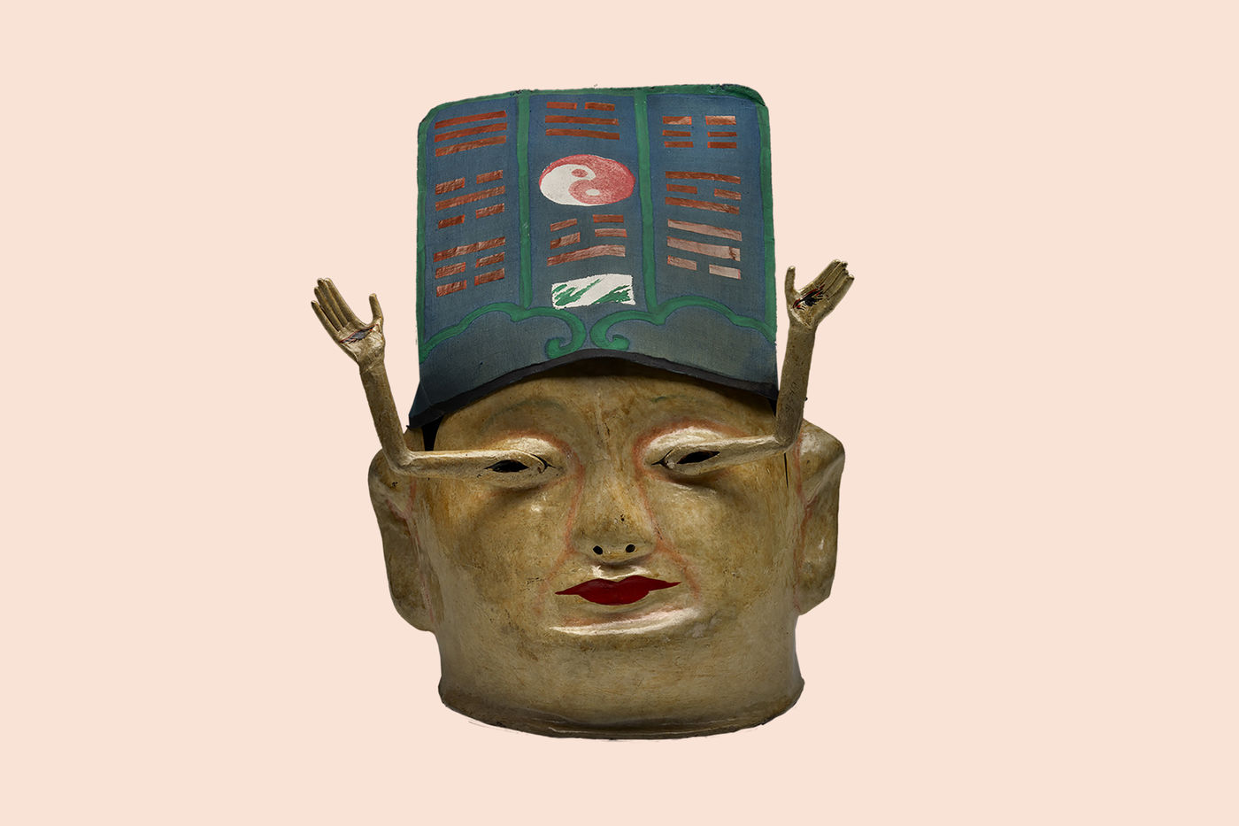 Worn during theatrical performances, this 19th-century mask depicts Yang Ren, who, after being blinded, used a spell to create new eyes—resulting in a pair of tiny arms growing from his eye sockets with all-seeing eyes in the palms of the tiny hands.
