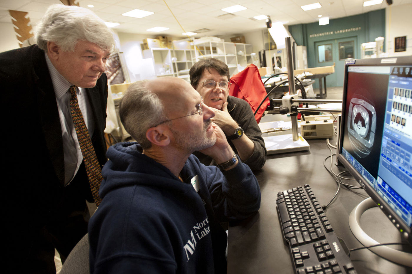 Researchers examine mummy CT scans in the Regenstein Lab.