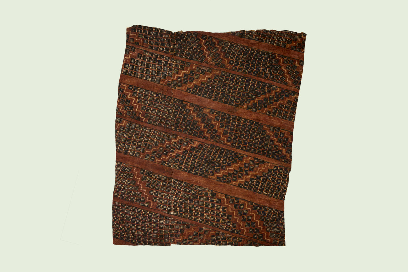 Tapa cloth is made from the inner bark of the paper mulberry tree that is processed into thin and flexible sheets. Usually decorated with patterns, tapa has been used for thousands of years for many purposes including clothing, blankets, and masks.