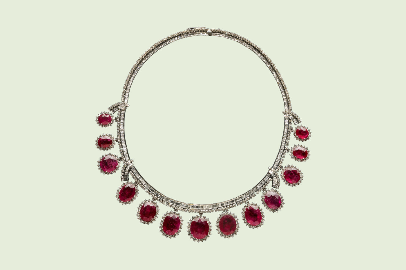 This glittering necklace showcases 13 rubies, totaling 90 carats, and hundreds of sparkling accent diamonds set in platinum.