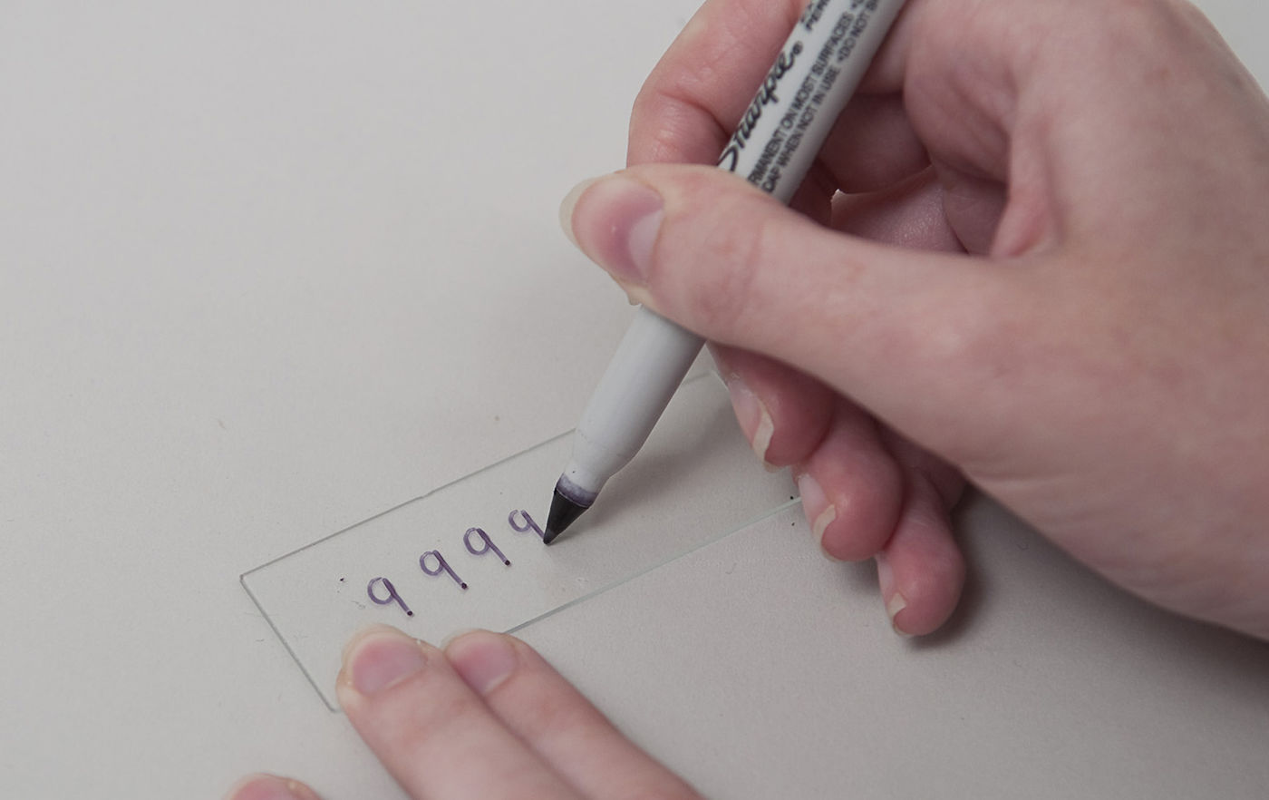 Using a fine Sharpie to write the 9's on the back of the parking slide.