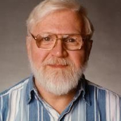 A man with white hair and a beard