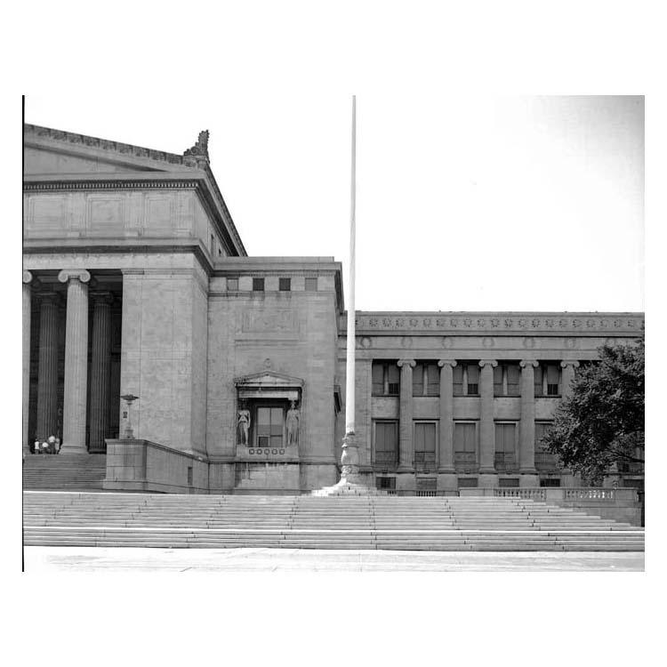 Northwest corner of The Field Museum exterior, including flagpole, torchere lamps and caryatid figures.