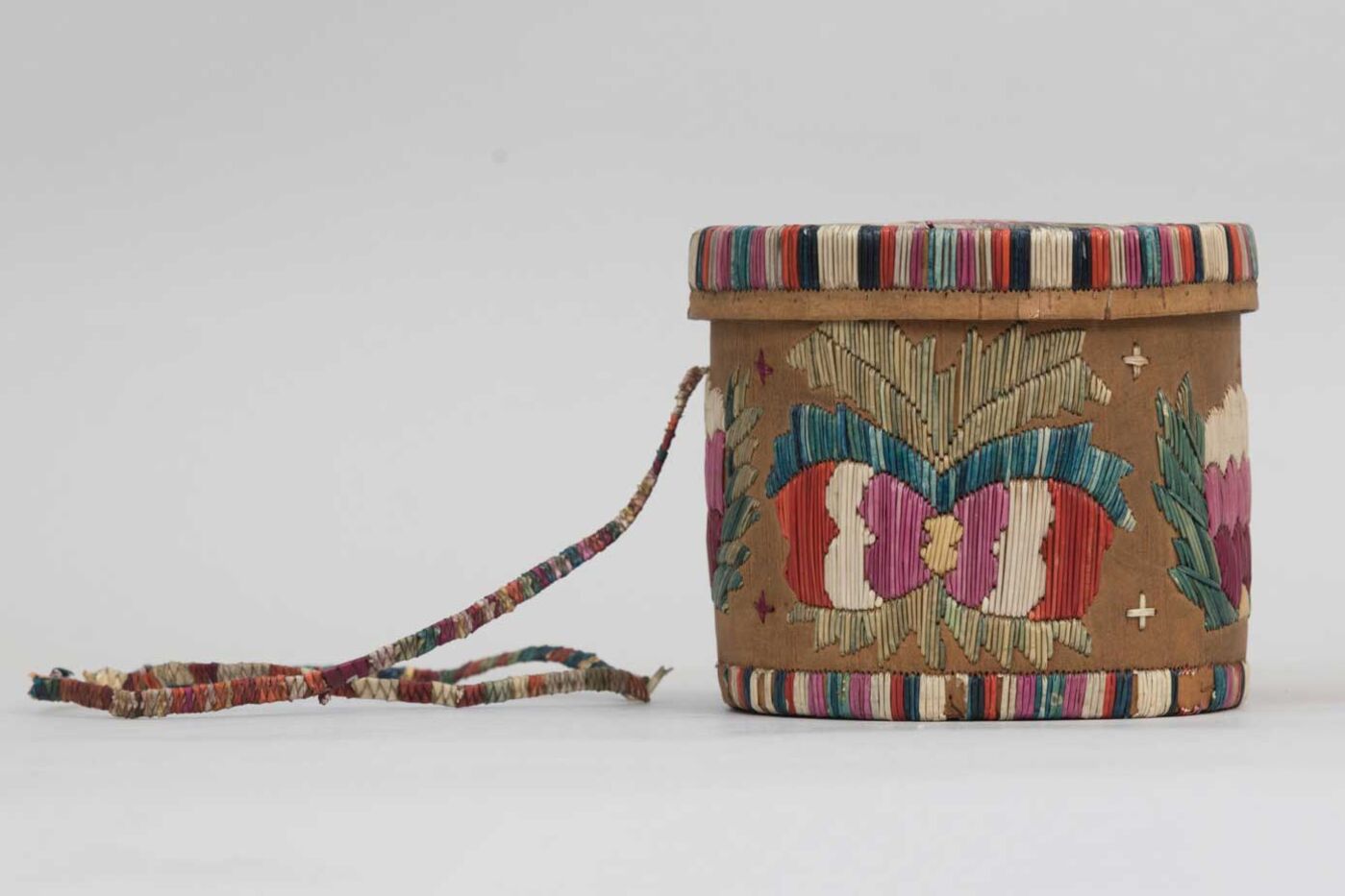 A birch bark basket, decorated with colorful quills.