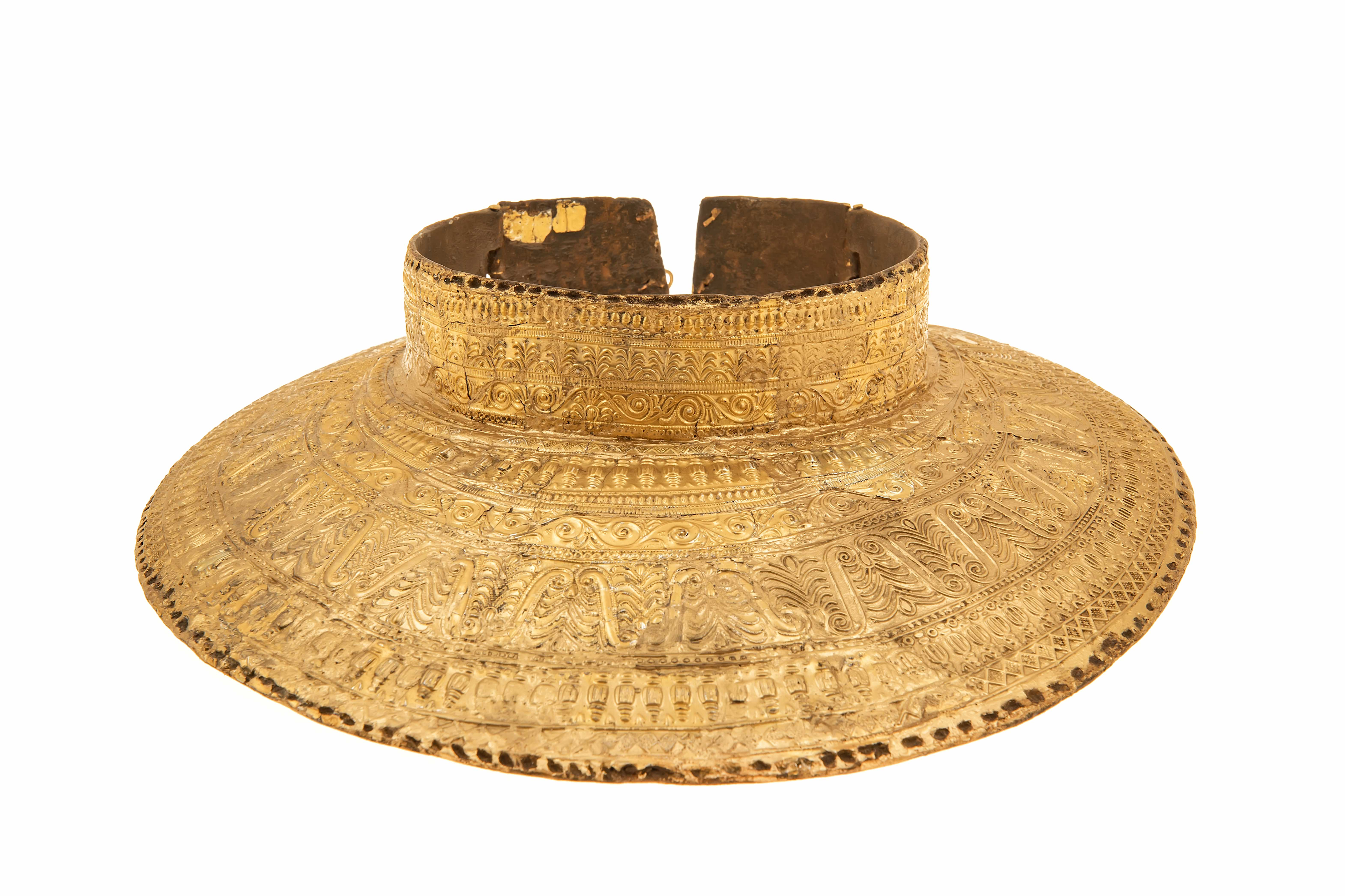 An etched gold breast plate.
