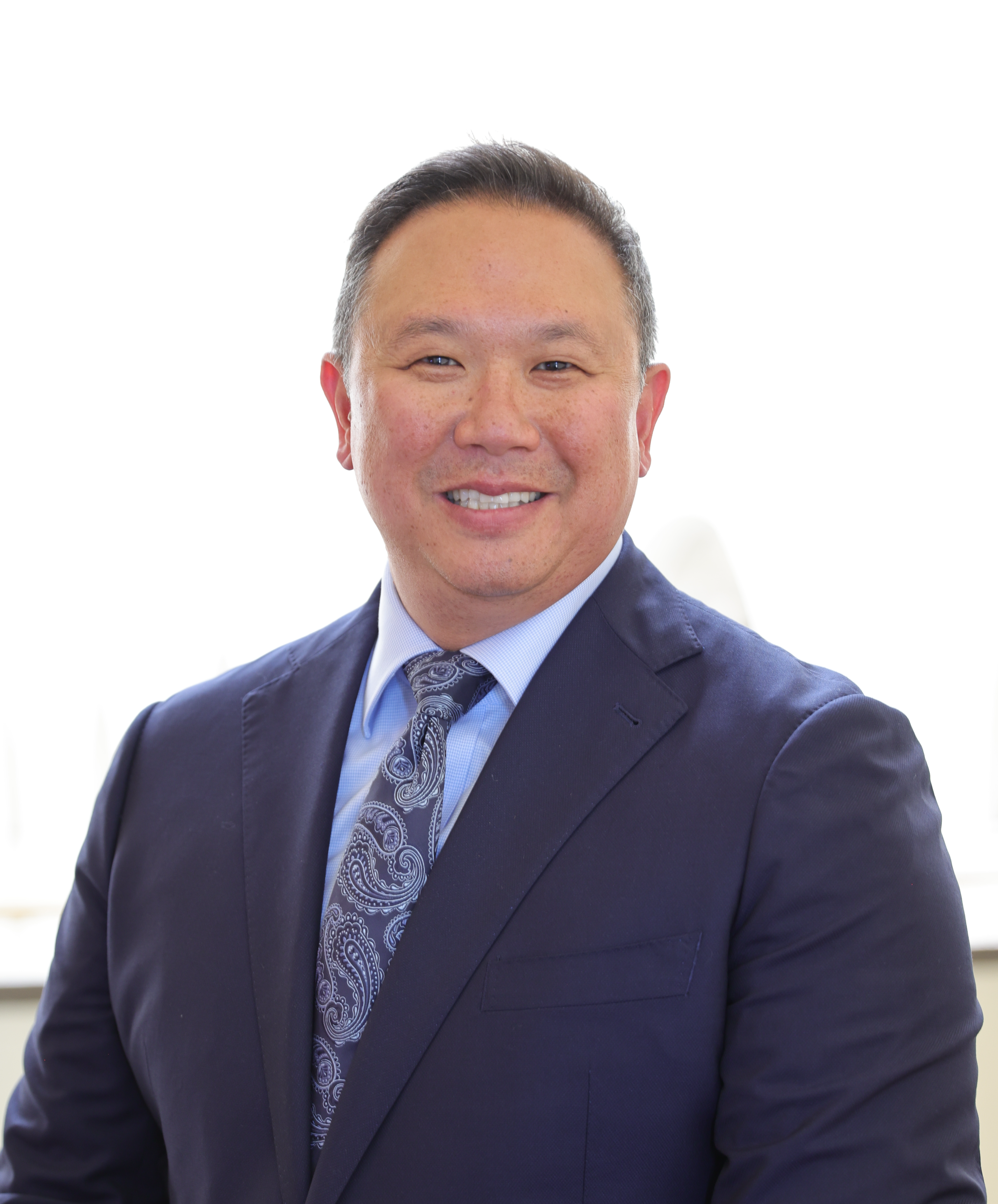 a man wearing a blue suit and tie