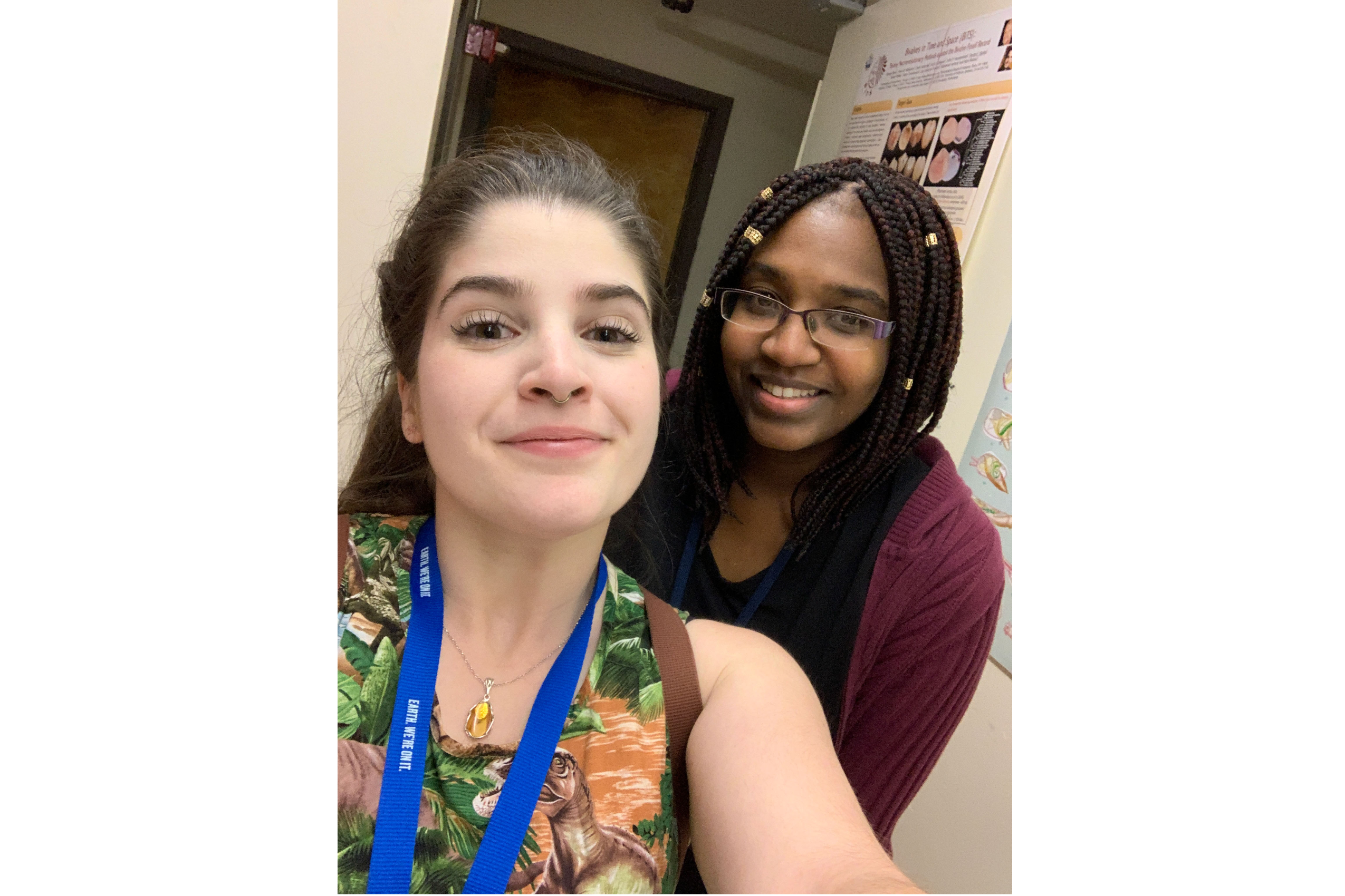 Two young women smiling, taking a selfie