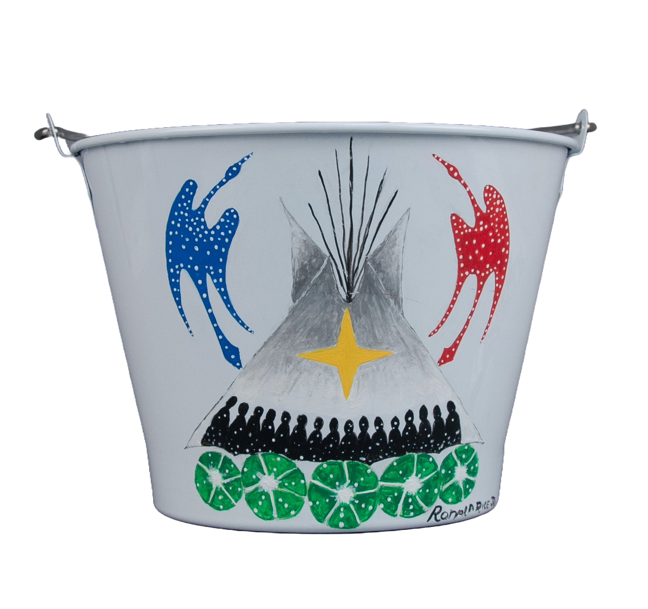 Detail picture of a painted metal water bucket. The background is white with a tipi painted in the center with black silhouettes of people sitting inside. Five round green plants are pictured below the tipi, and on either side are birds, one blue, the other red. At the center of the painting is a yellow four-pointed star.