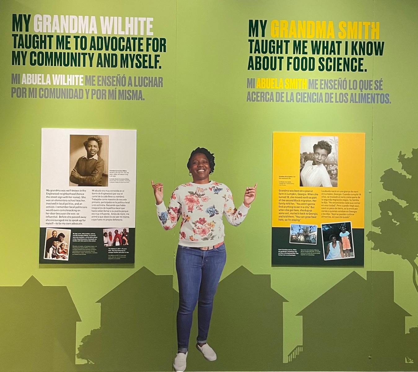 A graphic panel from a museum exhibition, with a life-size image of a woman standing between graphics with text.