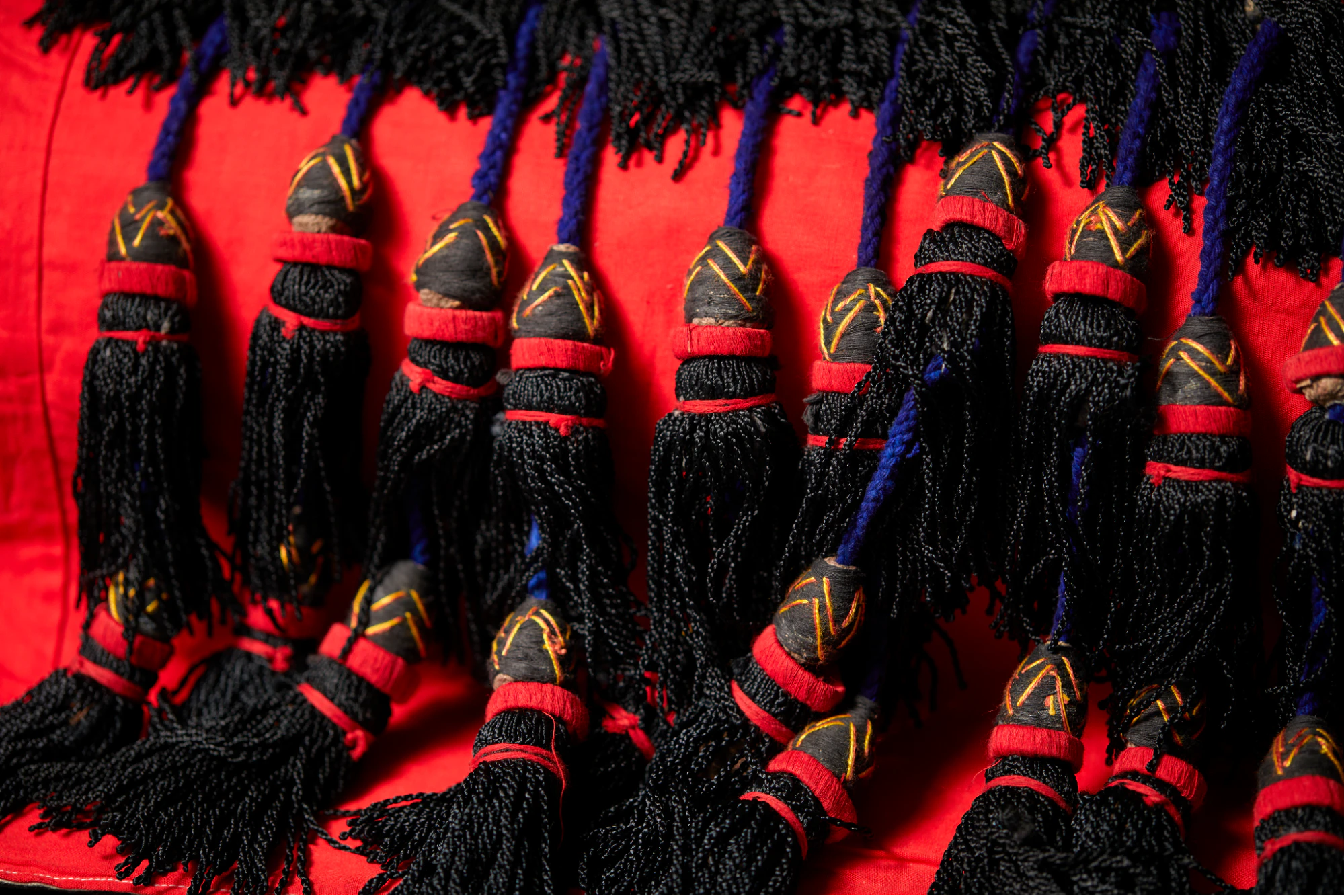 Close-up detail of tassels on the Motherland Reigns garment