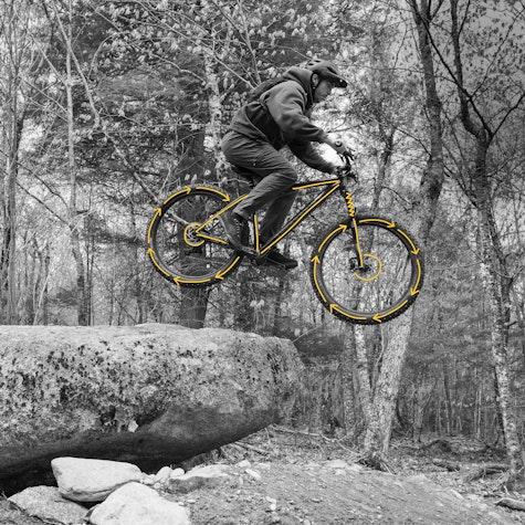 Person riding with mountain bike