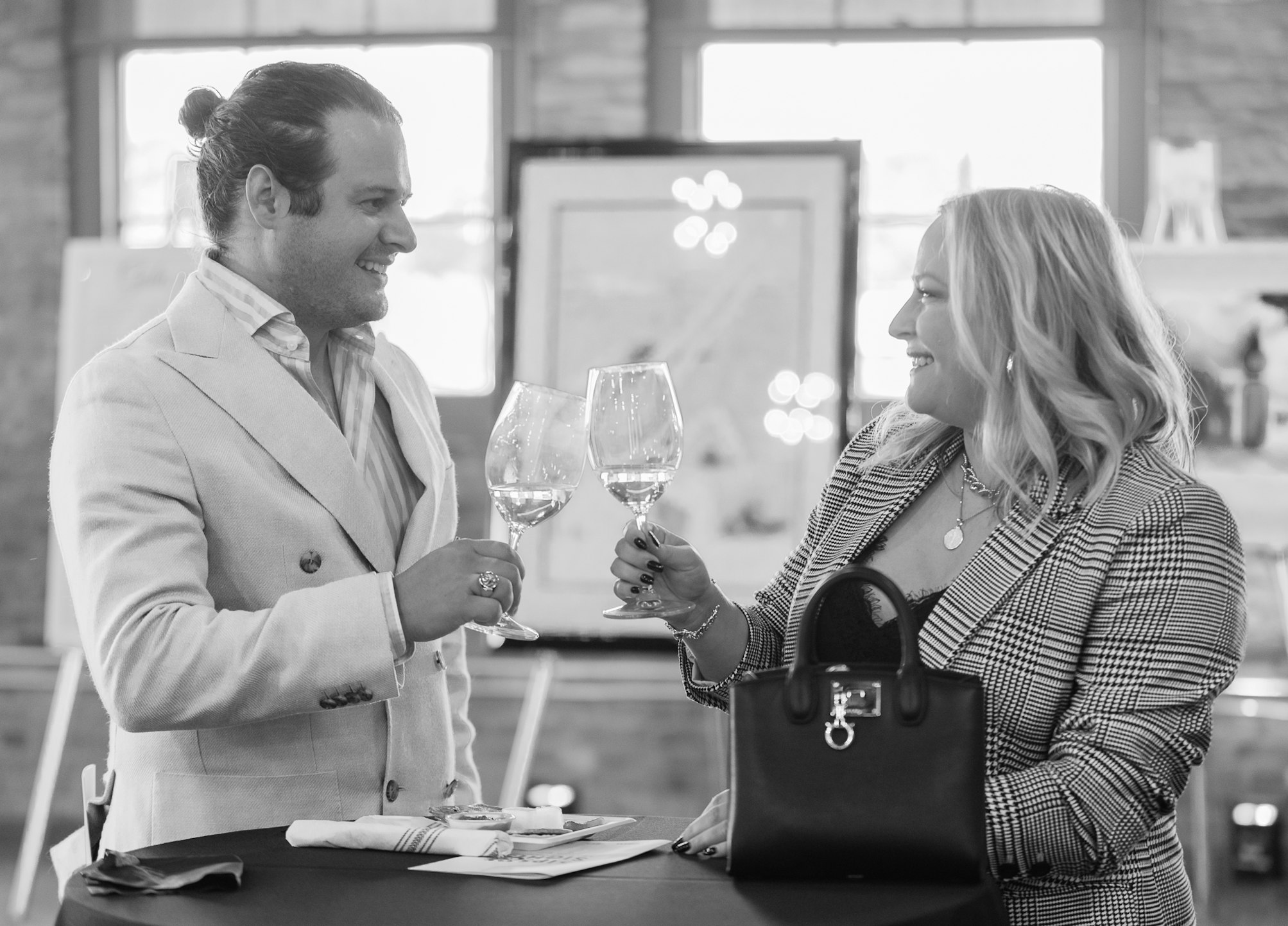guests cheers sips and sights black and whtie