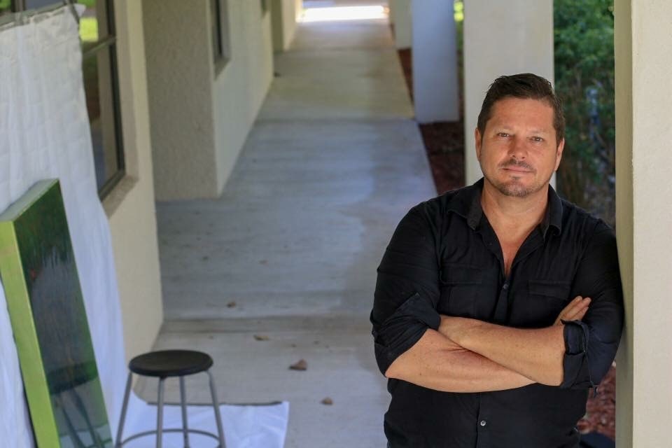 Richard Lowe standing outside studio