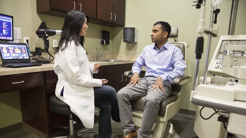 Eye doctor consults patient