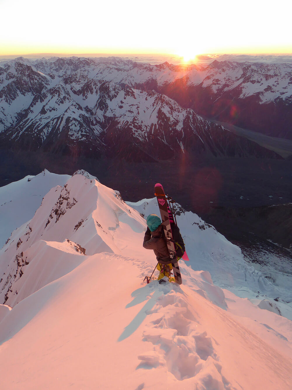 Taking a moment to admire the stunning views halfway up the East Ridge as the sun cast light on the mountains peaks. Photo:Enrico Mosetti