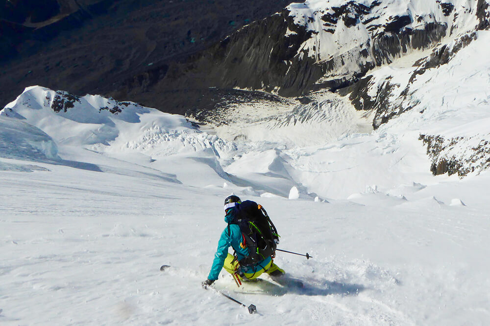 Taking it in turns the team make their way down the large open slopes of the upper face. Photo: Enrico Mosetti