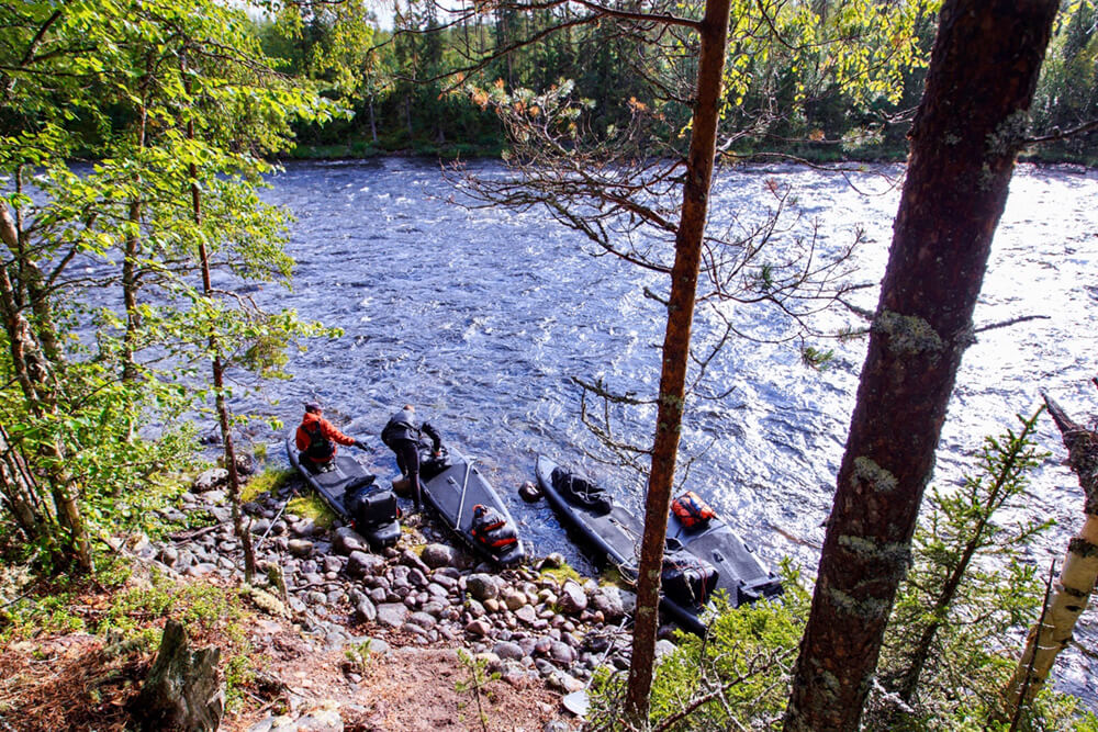 Loading up the boards once again. Only to unload them again 1km further down. Photo: Jay Dike