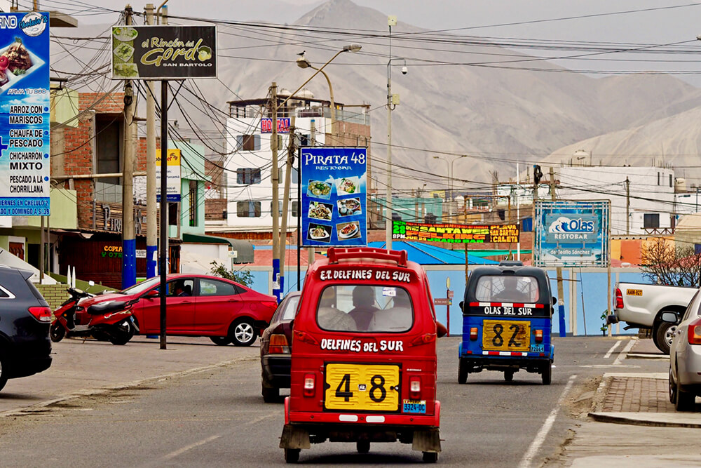 The quiet colourful town of San Bartolo, Peru sits between the Pacific Ocean and the Andes.