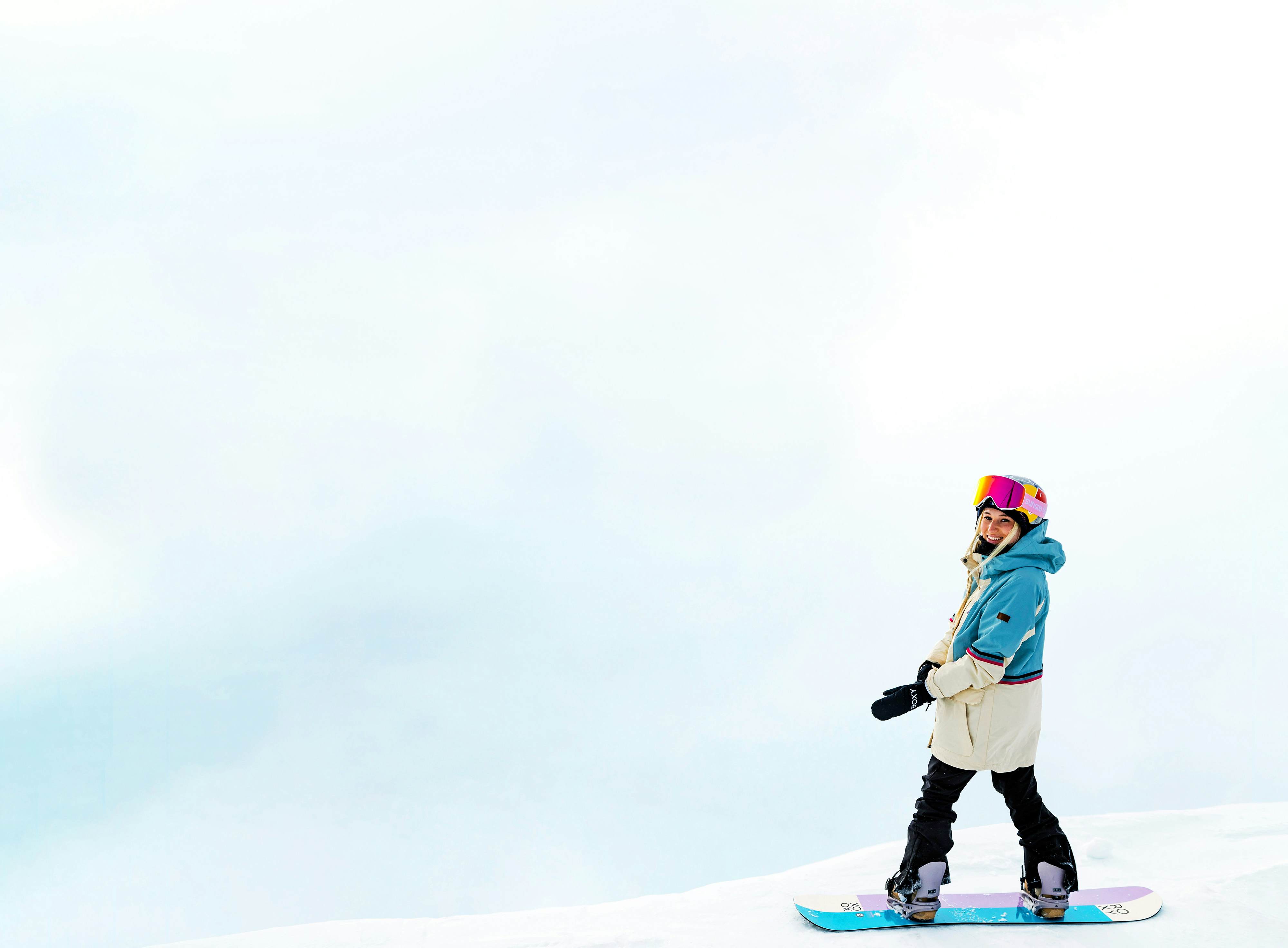 Katie Ormerod snowboarding in SunGod vanguards goggles