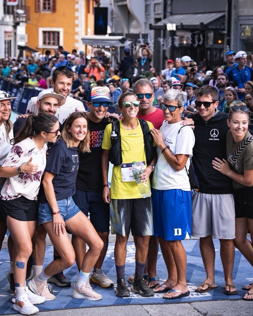 Courtney Dauwalter and her support team on the UTMB finish line