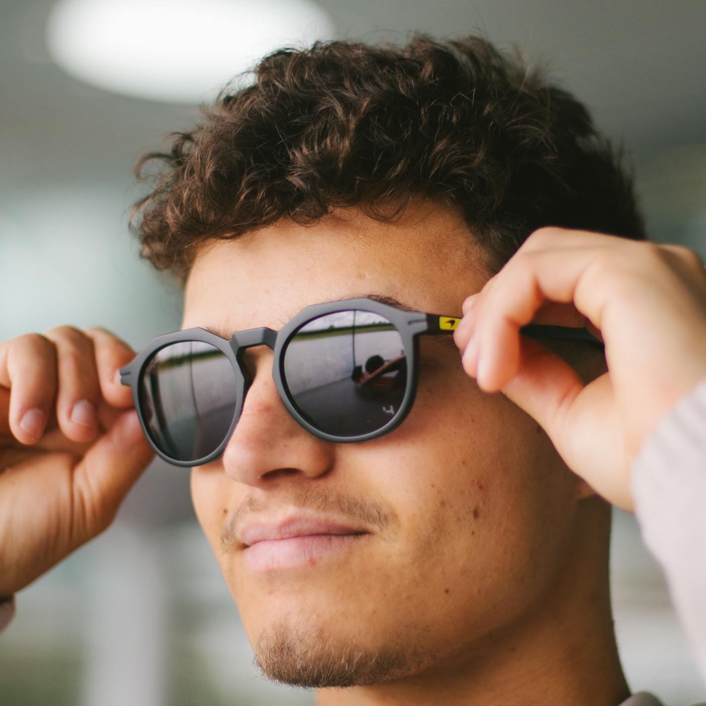 Lando Norris wearing SunGod Zephyrs Sunglasses