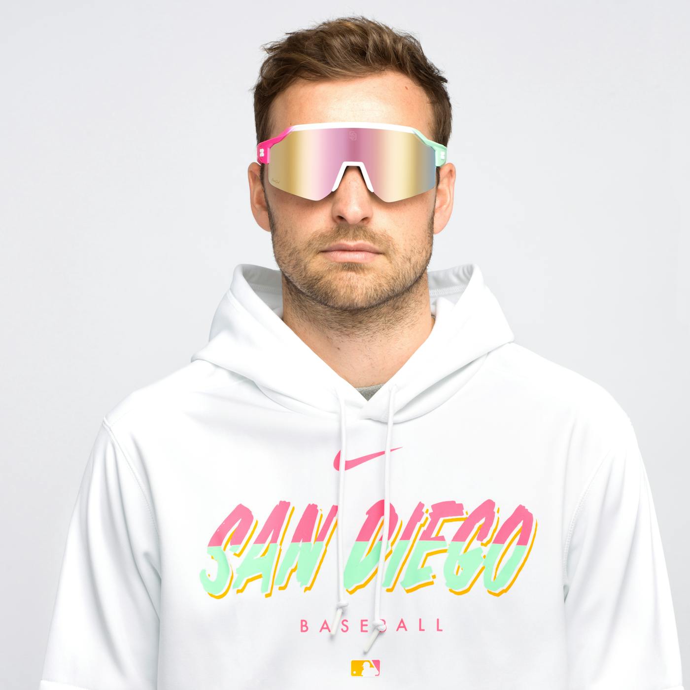 Male model wearing San Diego Padres City Connect Vulcans Sunglasses