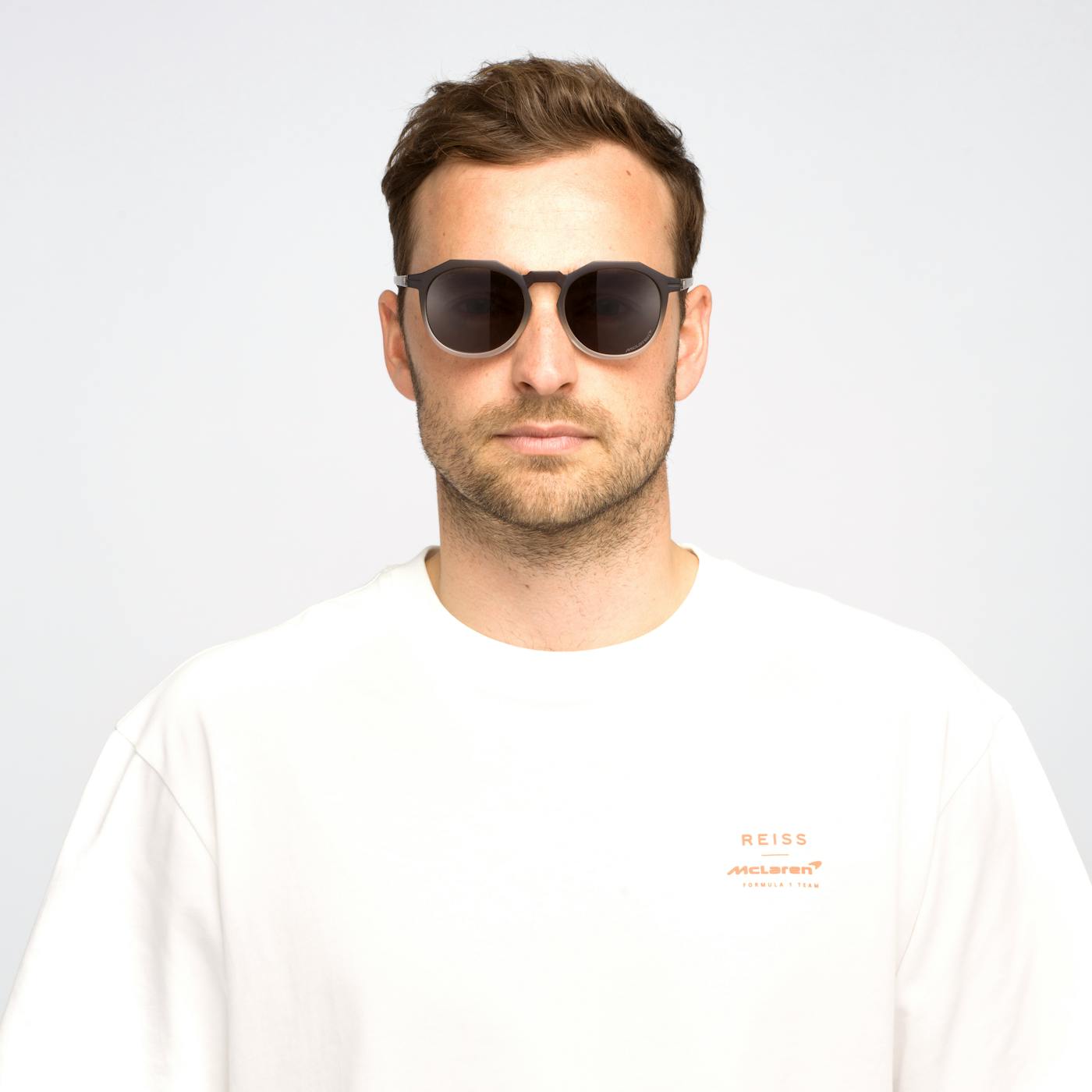 Male model wearing McLaren Zephyrs sunglasses