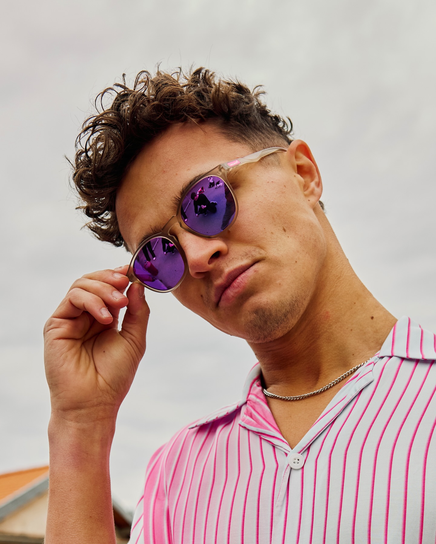 Lando Norris wearing SunGod Sunglasses