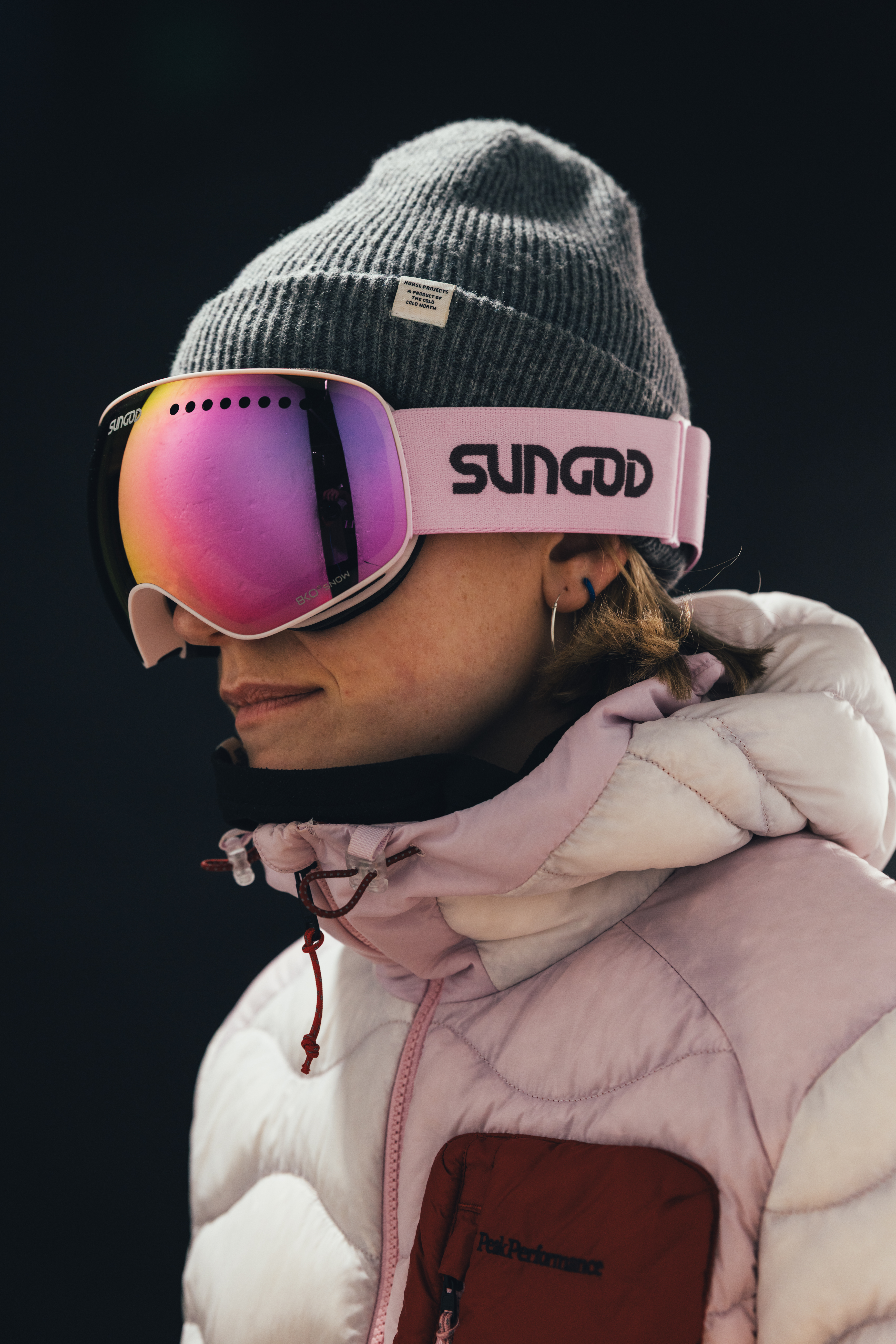 Woman wearing Snipers in Alpine Blush with Pink 8KO Snow Lenses