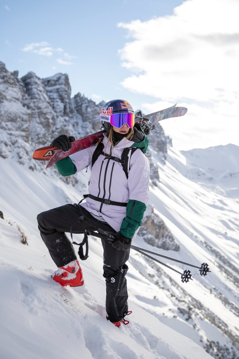 skier in front of mountains