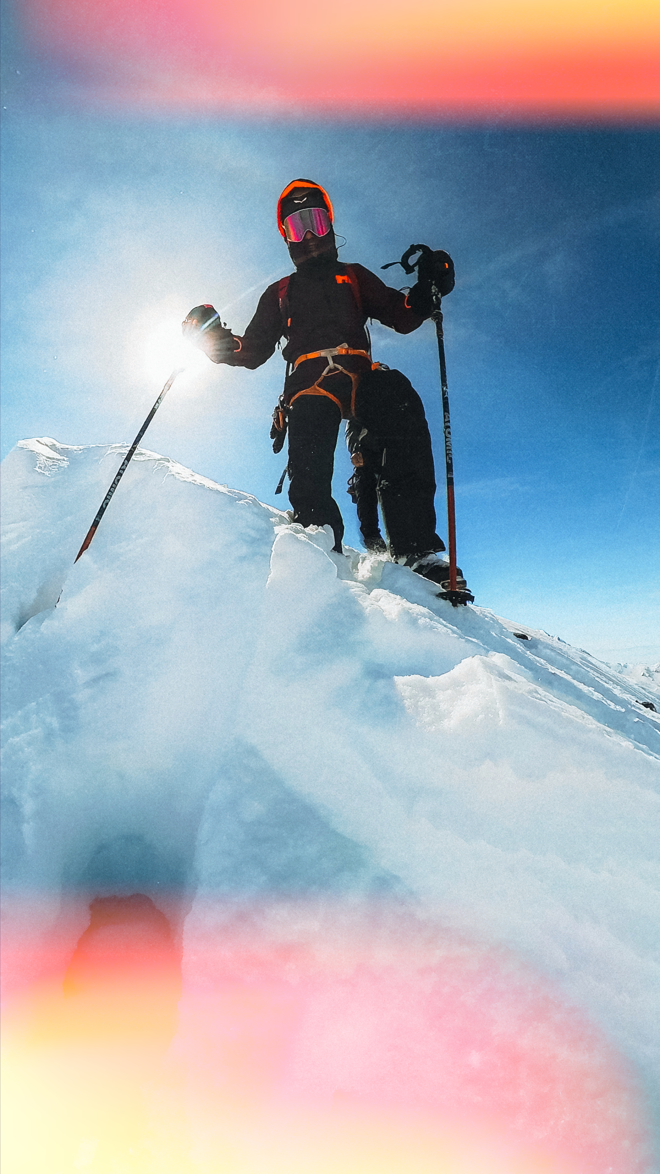 skier in front of sunlight