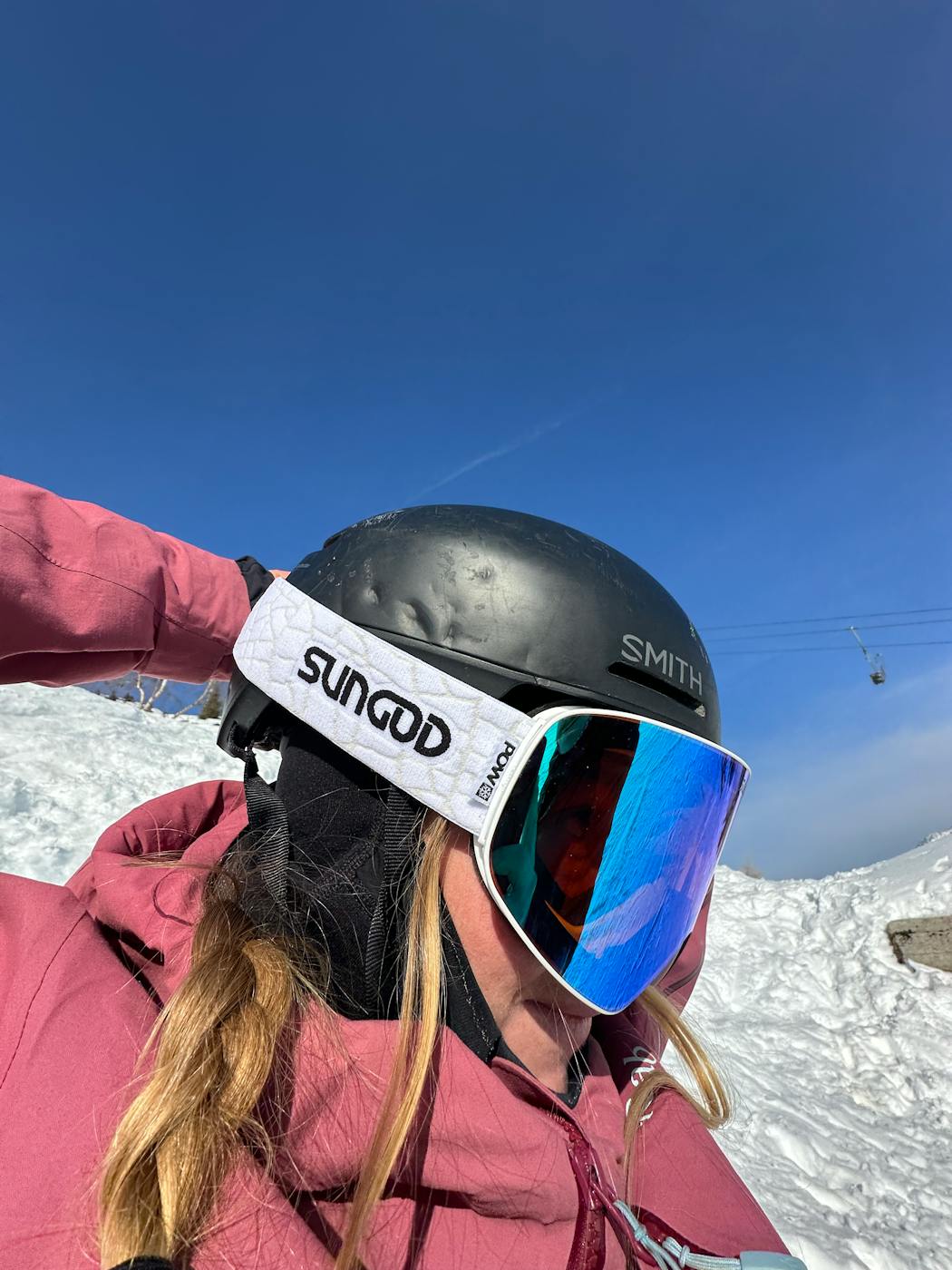 woman wearing SunGod snow goggles