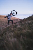 Person on a mountain with bike