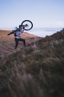 Person on a mountain with bike