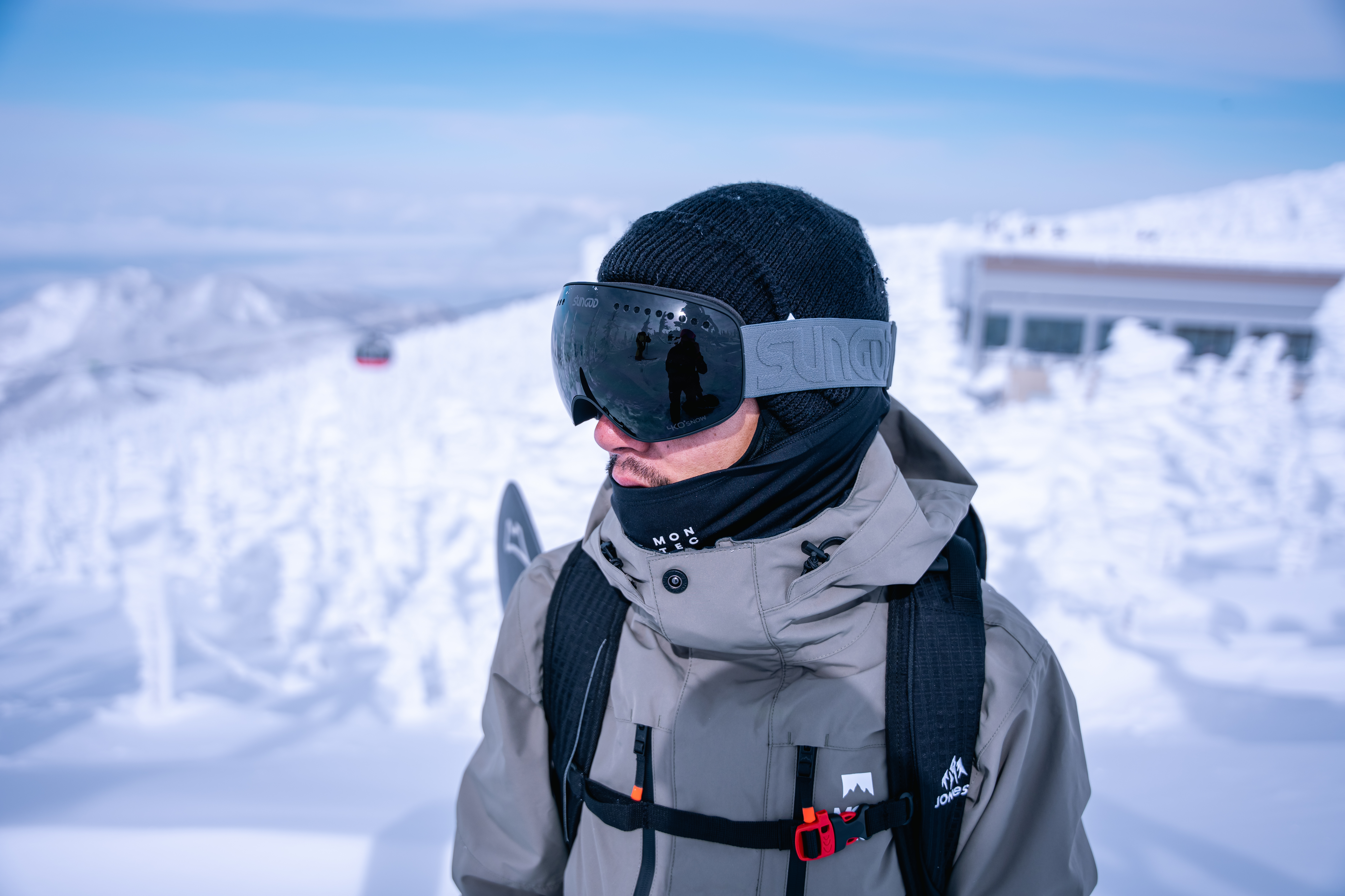 Man in front of snow in SunGod goggles