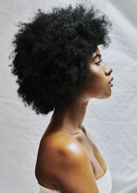 side profile of darker skinned model with beautiful neck