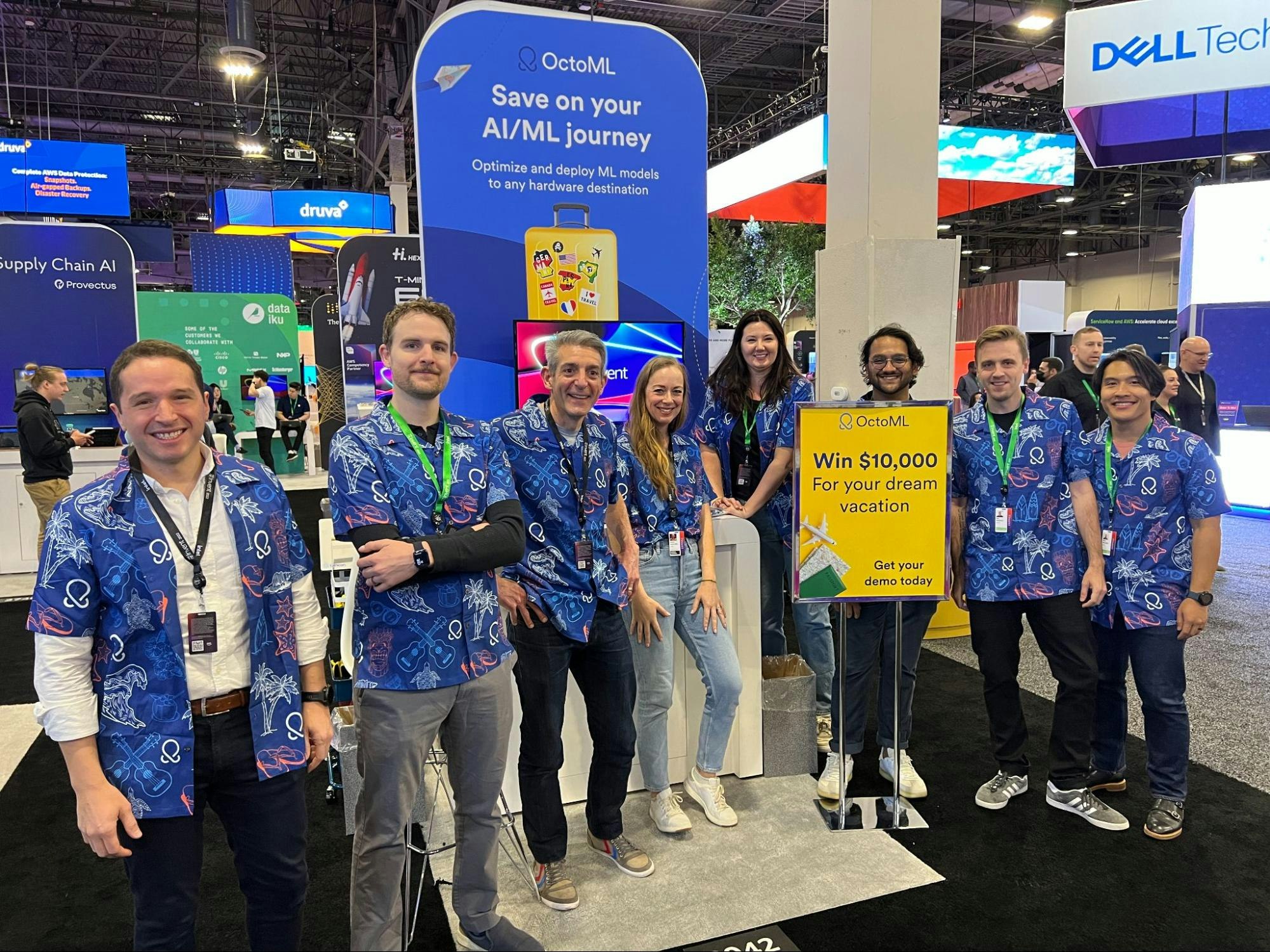 OctoML employees at the OctoML booth at AWS re:Invent 2022 showcasing the giveaway prize || '