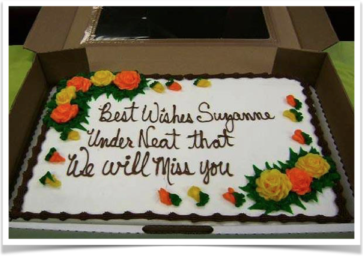 Cake that reads: Best wishes Suzanne under neat that we will miss you