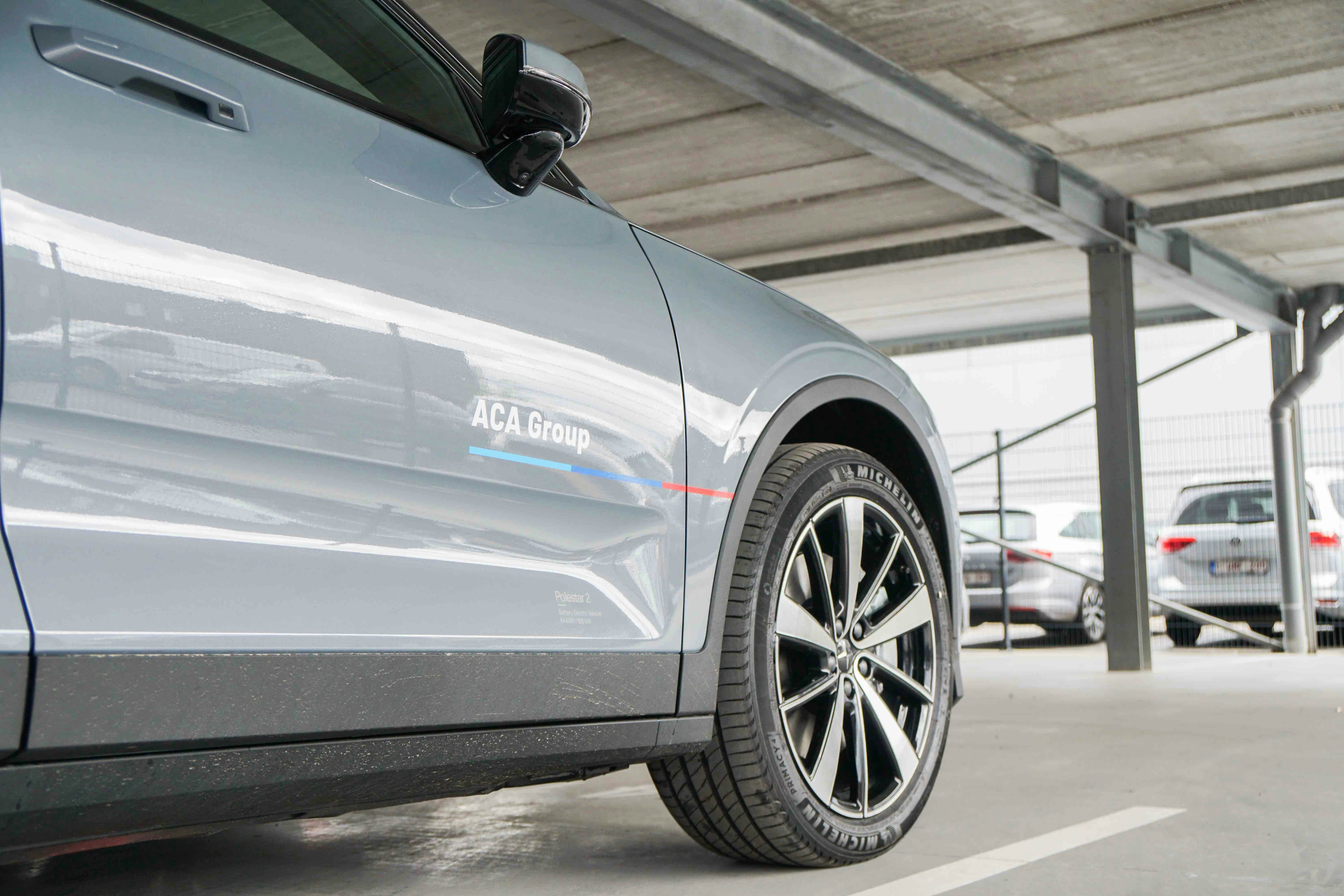 Polestar 2 electric vehicle with ACA Group branding