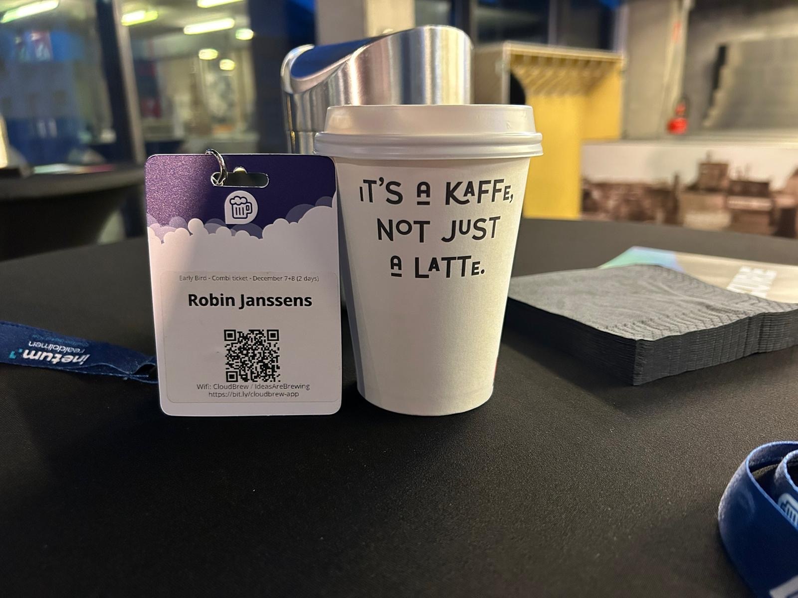Team member Robin Janssens his cloudbrew badge and coffee