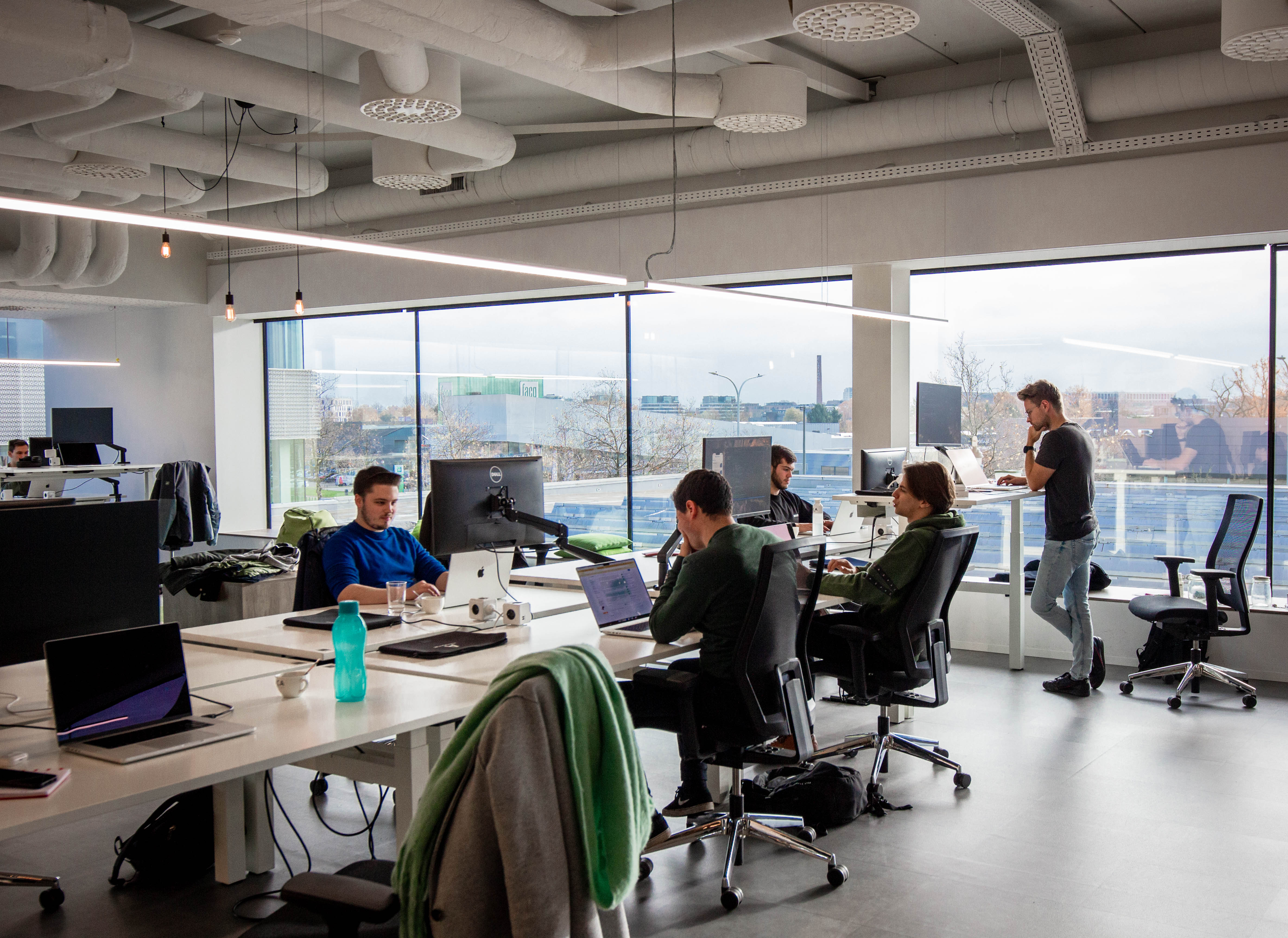 mobile team working in open space at aca group