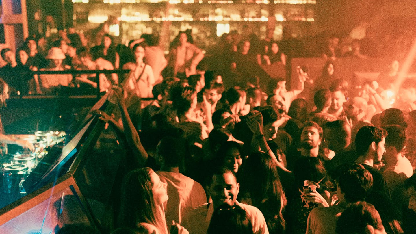 Crowd dancing in front of DJ in the Hall